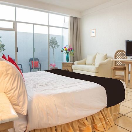 Capital O Hotel Villa Monini Puebla Buitenkant foto